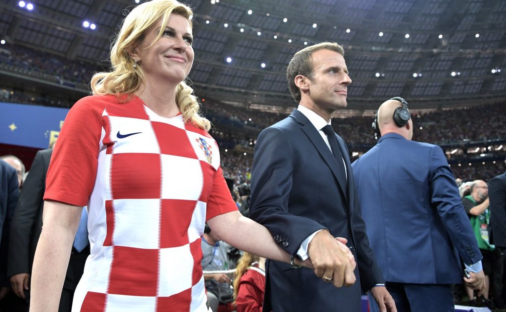Kolinda_Grabar-Kitarović_and_Emmanuel_Macron_prepare_to_award_the_first_and_second_places_in_the_final_of_the_2018_Russian_Football_Cup